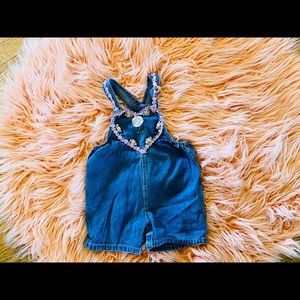 Girls Vintage overall shorts. With flower detail.